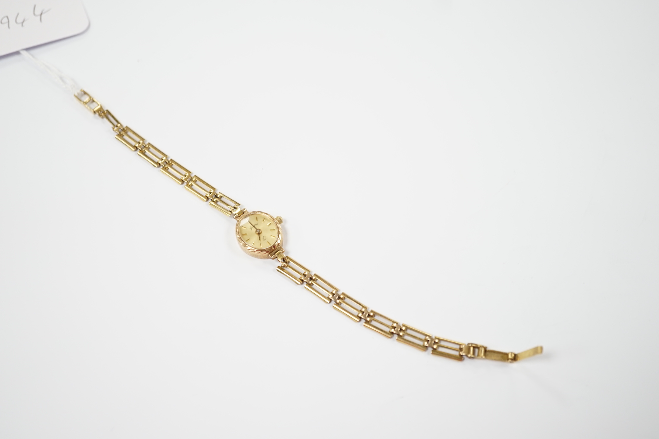 A lady's 9ct quartz wrist watch, on a 9ct gold bracelet, overall length 18cm